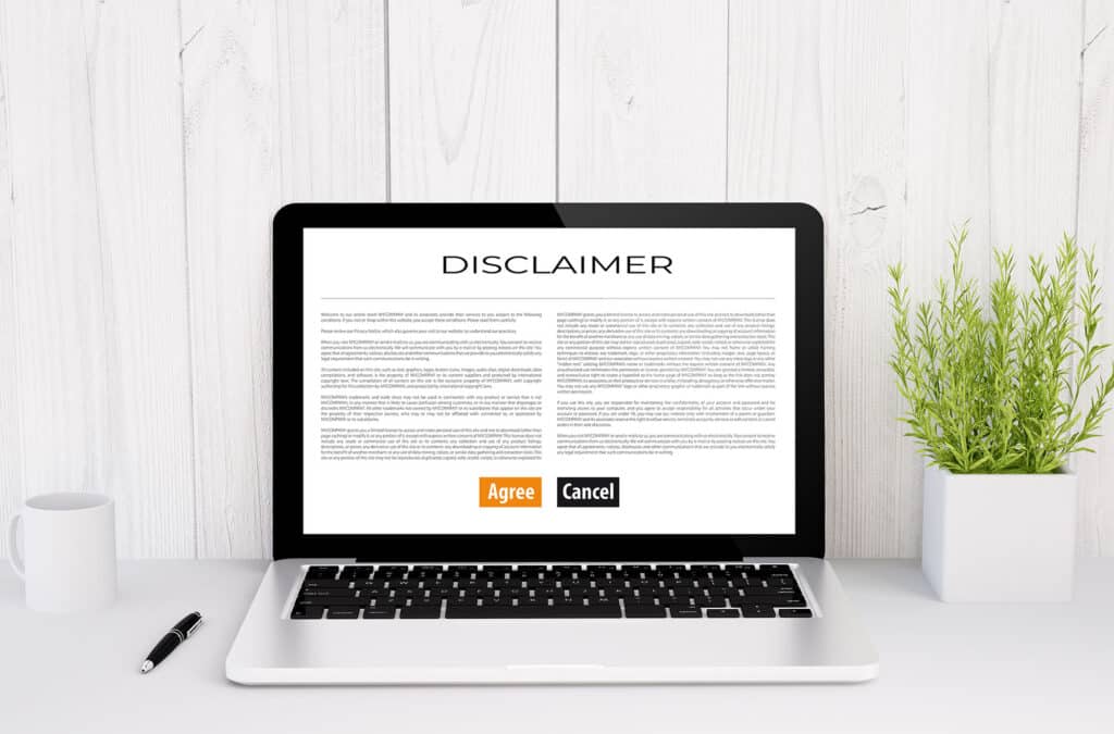 Laptop screen showing disclaimer with agree and cancel buttons