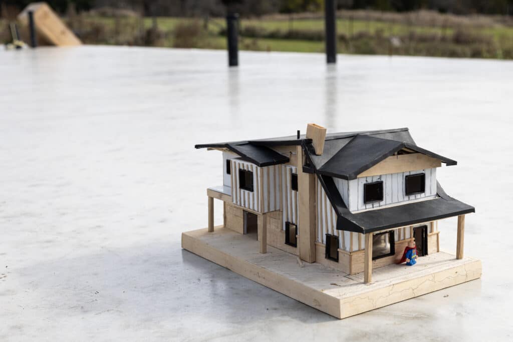 Architectural model of a house on a white surface