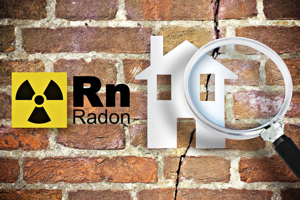 Radon hazard symbol and house silhouette on cracked brick wall