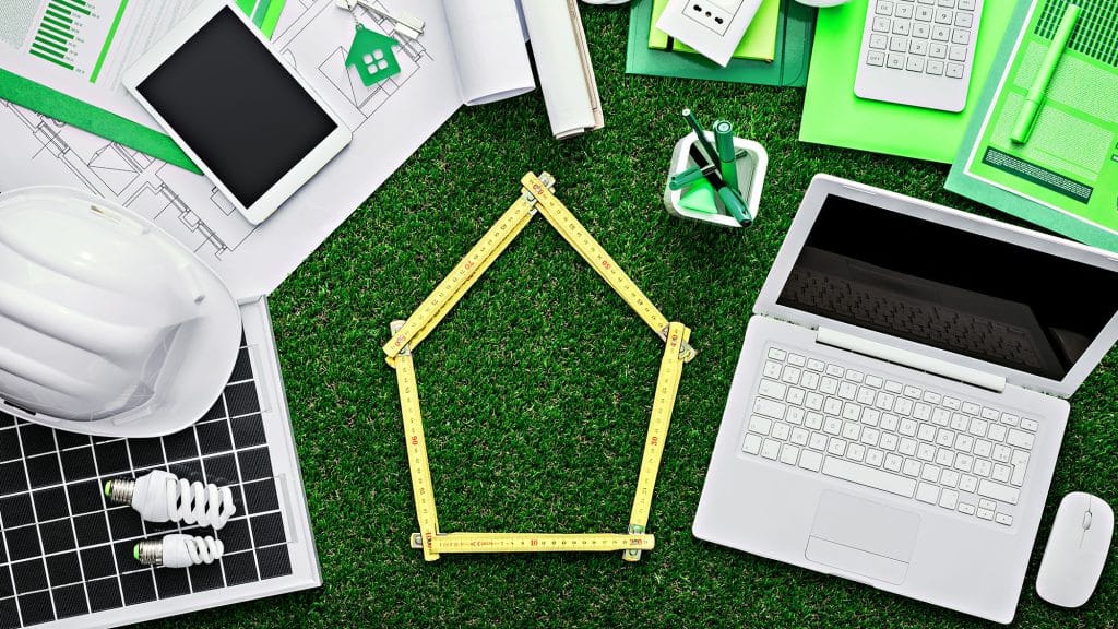 Eco-friendly office with green tools and laptop