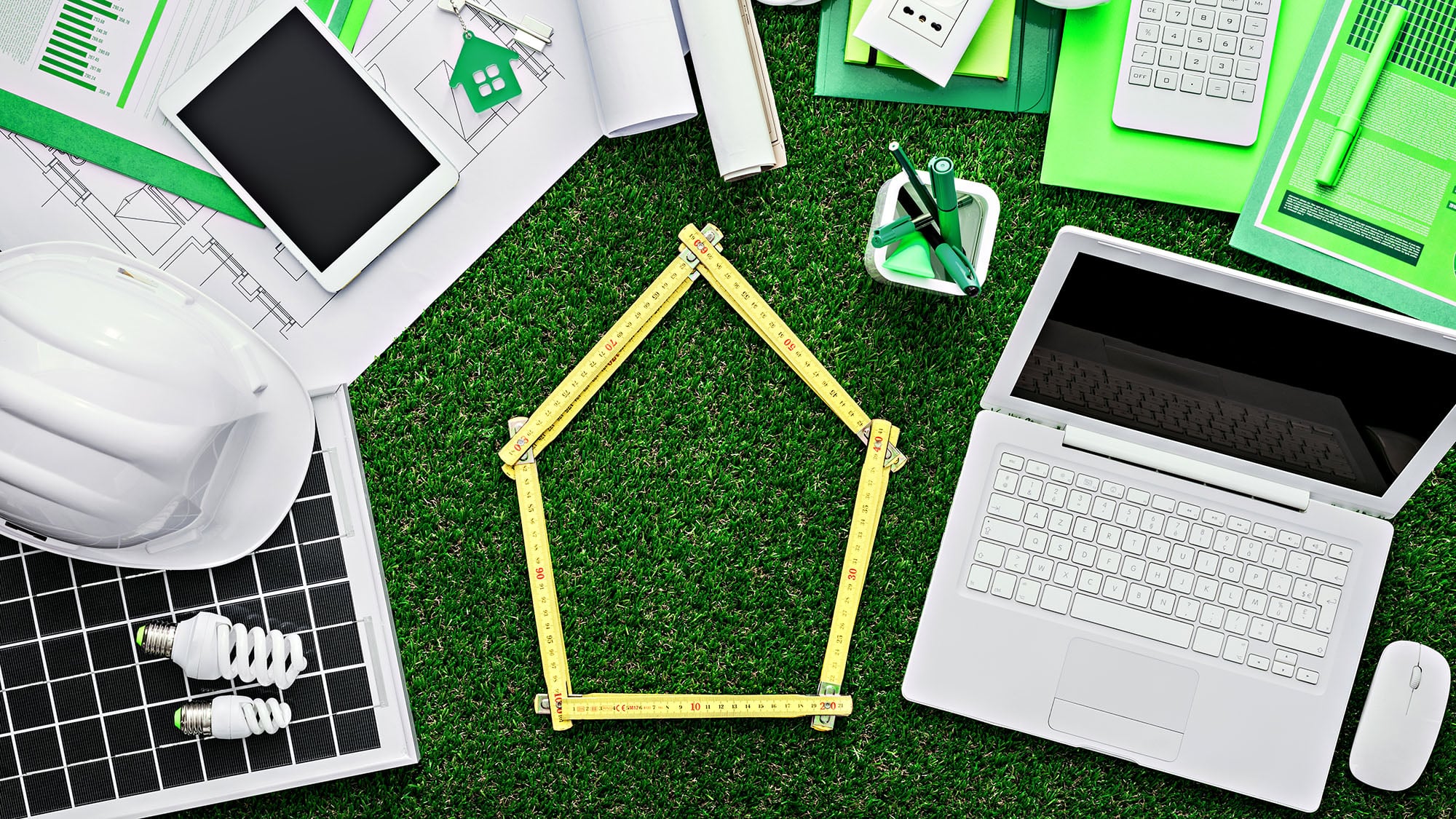Eco-friendly office with green tools and laptop