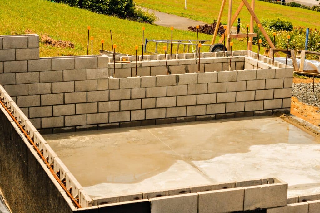 Concrete foundation and cinder block wall construction site