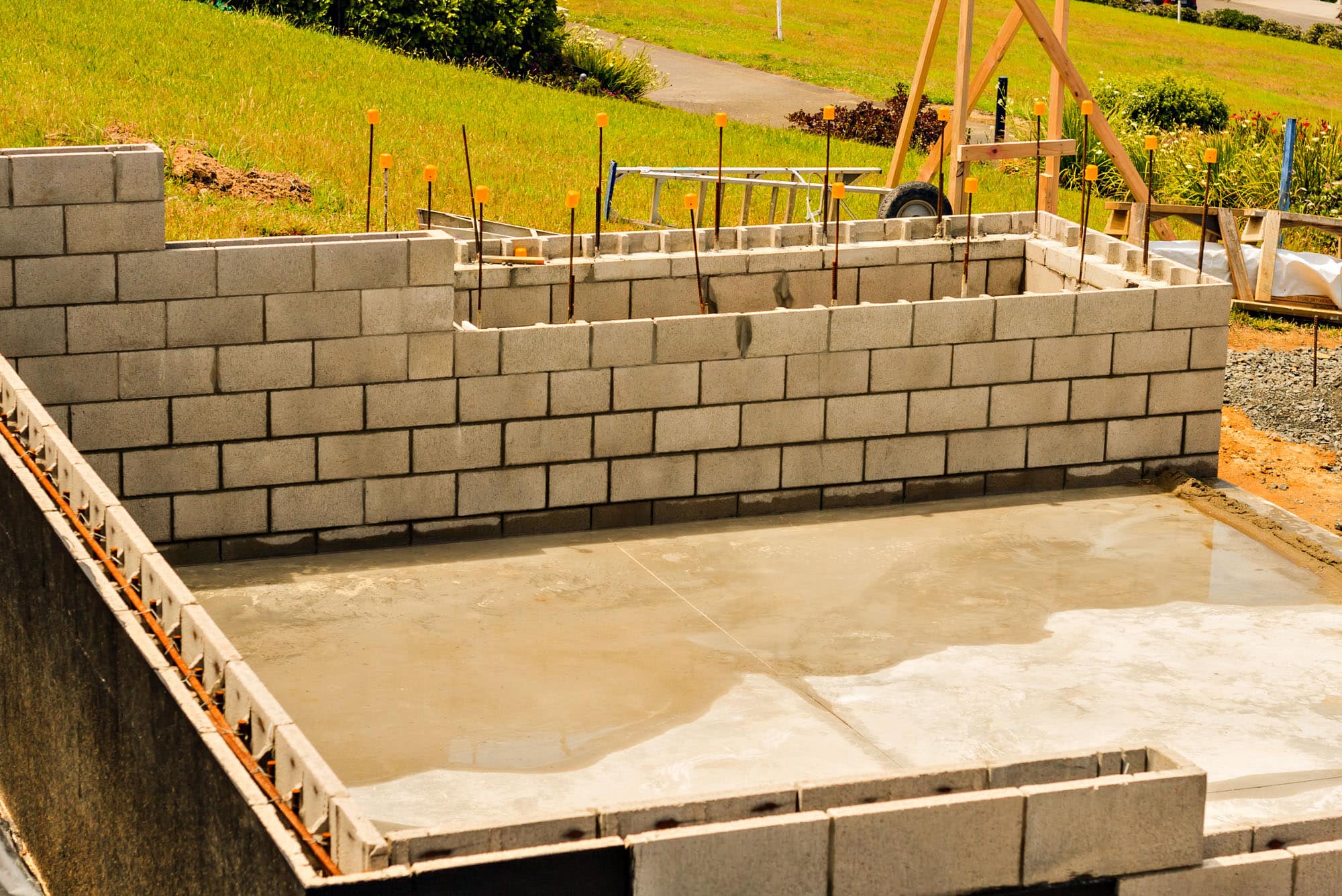 Concrete foundation and cinder block wall construction site