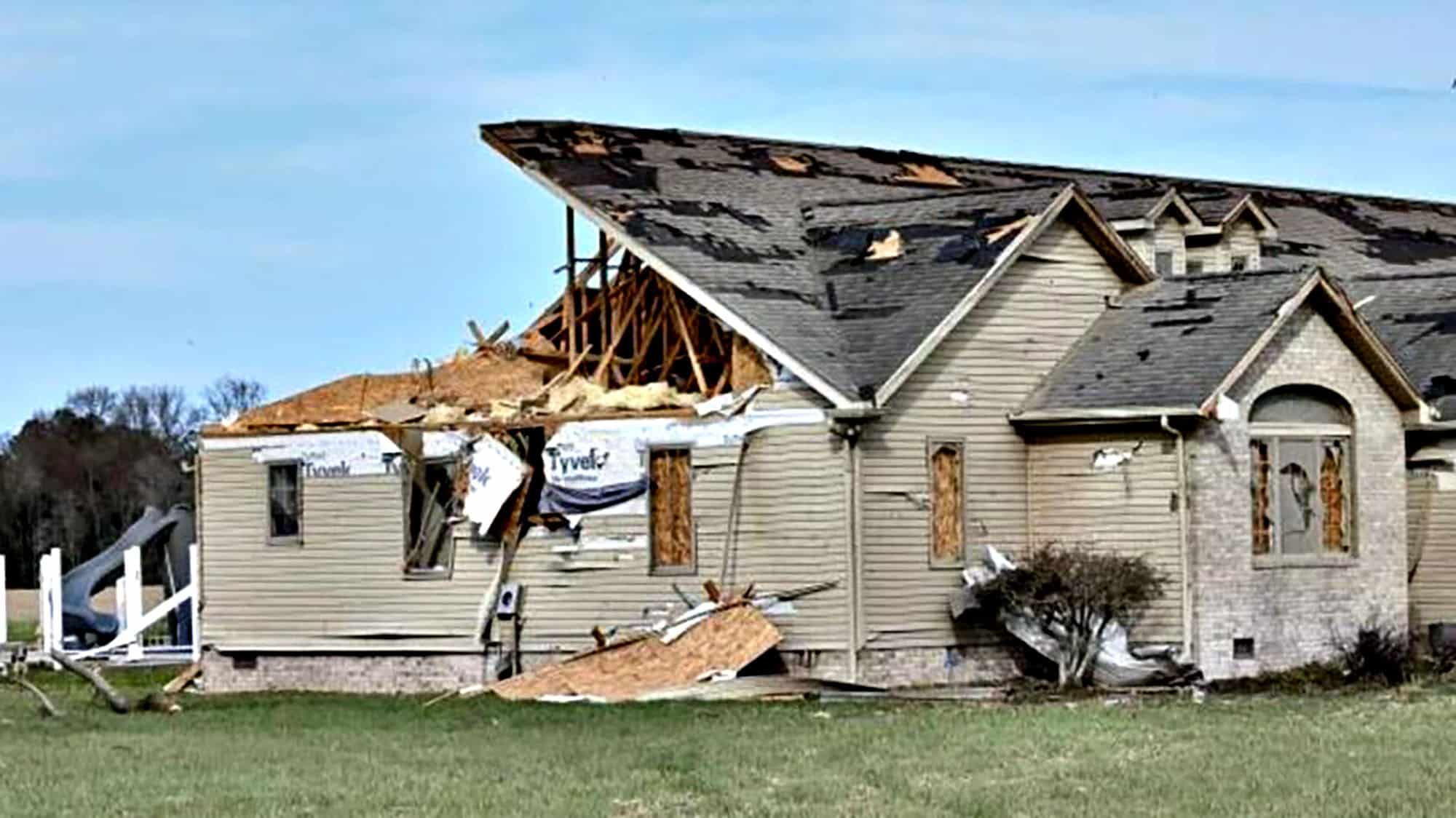 House with roof damaged by storm