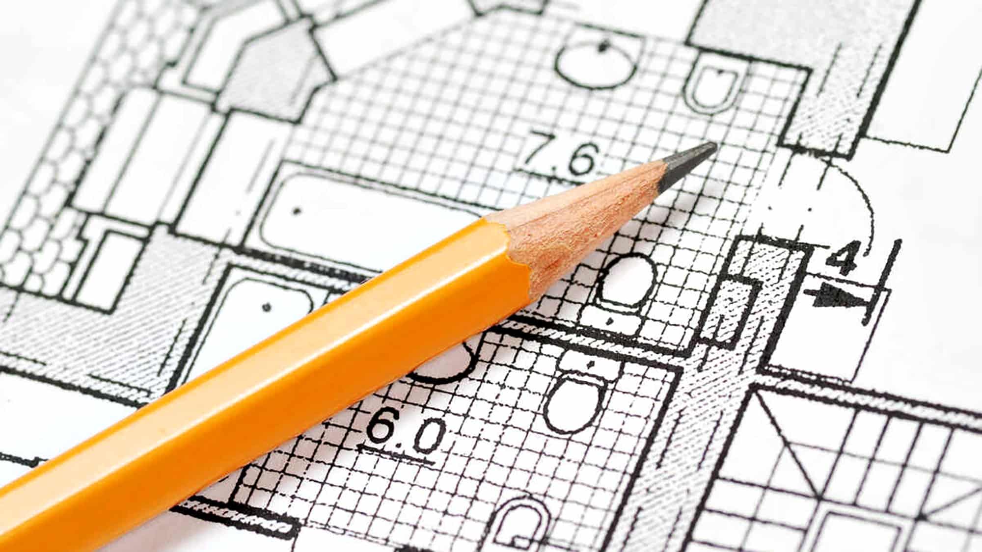 Architectural blueprint with pencil highlighting bathroom layout