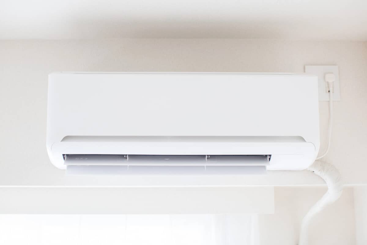 Wall-mounted white split air conditioner for home climate control