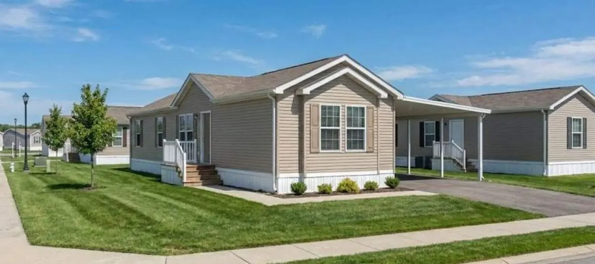 Neighbourhood of modern manufactured homes on a sunny day