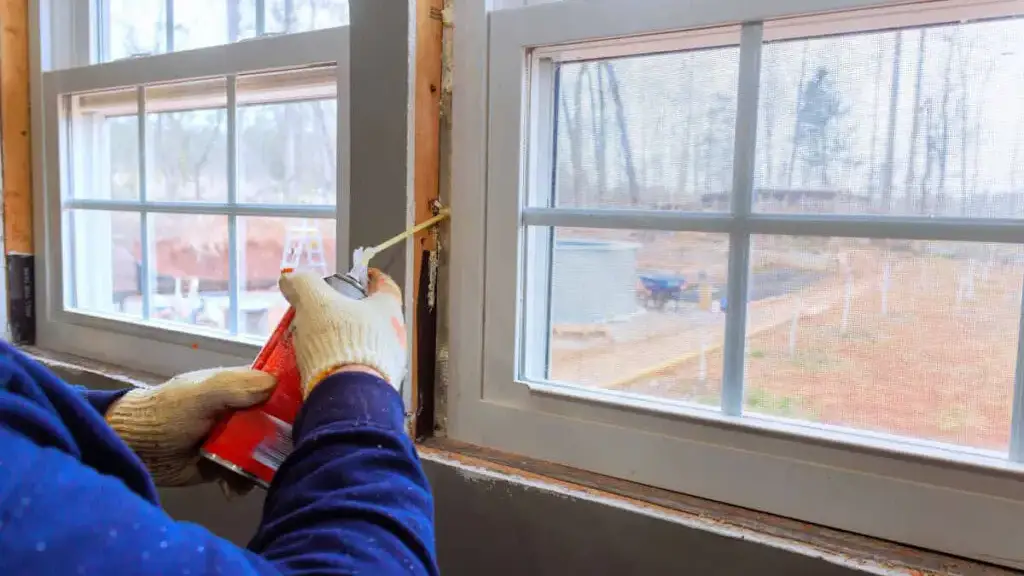 Installing new energy-efficient window with expanding foam sealant