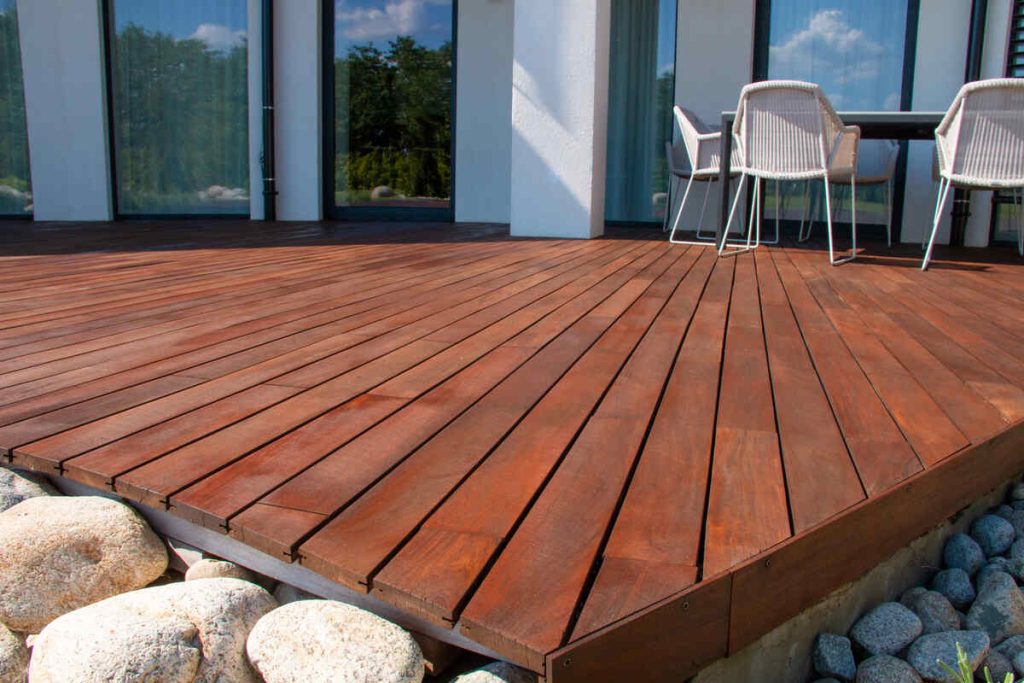Contemporary patio deck with wooden flooring and outdoor furniture
