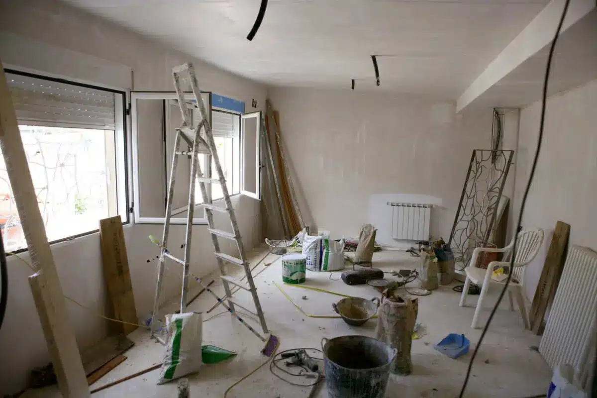 Home renovation in progress with ladder and construction materials