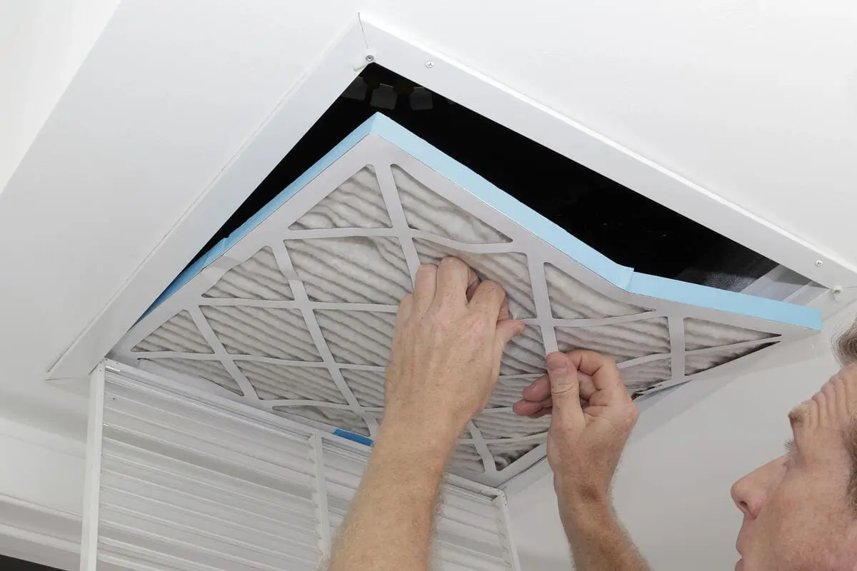 Changing an air filter in a ceiling vent